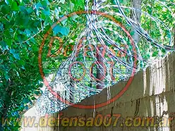 Instalación de concertina helicoidal cruzada de 45 cm sobre muro. Zona Comodoro Rivadavia.