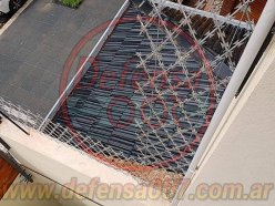 Concertina romboidal de 50 cm sobre muro. Zona CABA.
